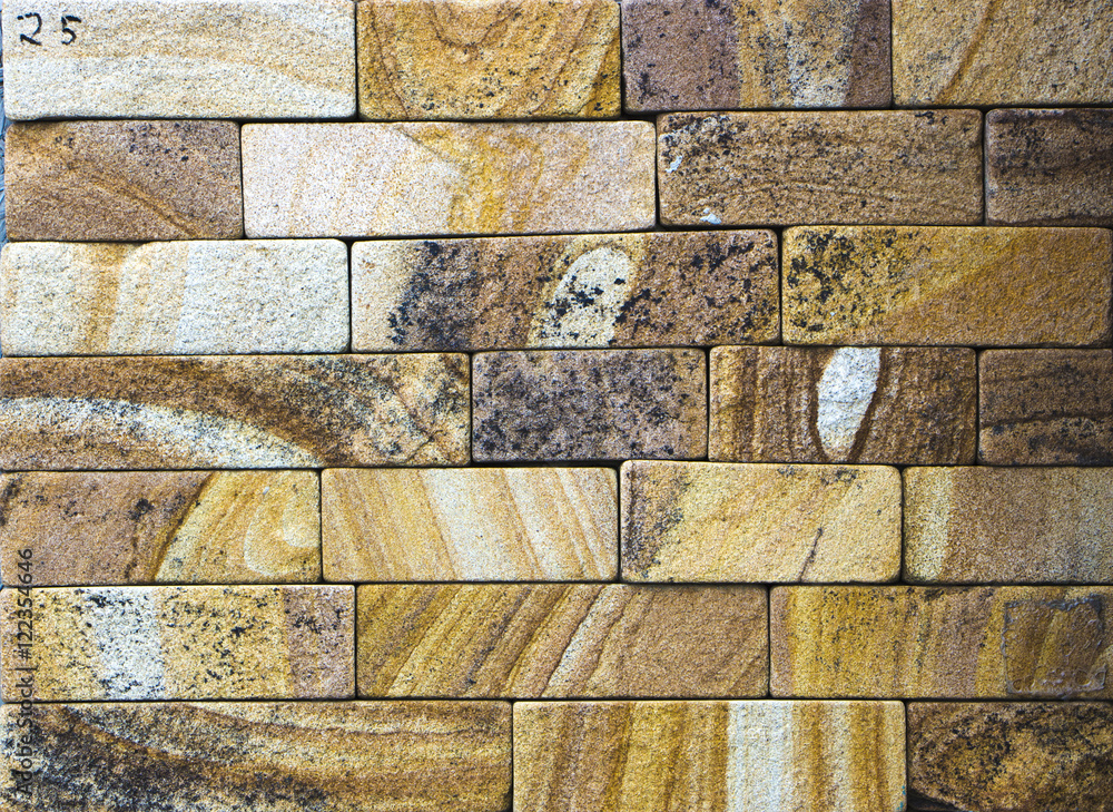 texture of colored sandstone bricks close-up,