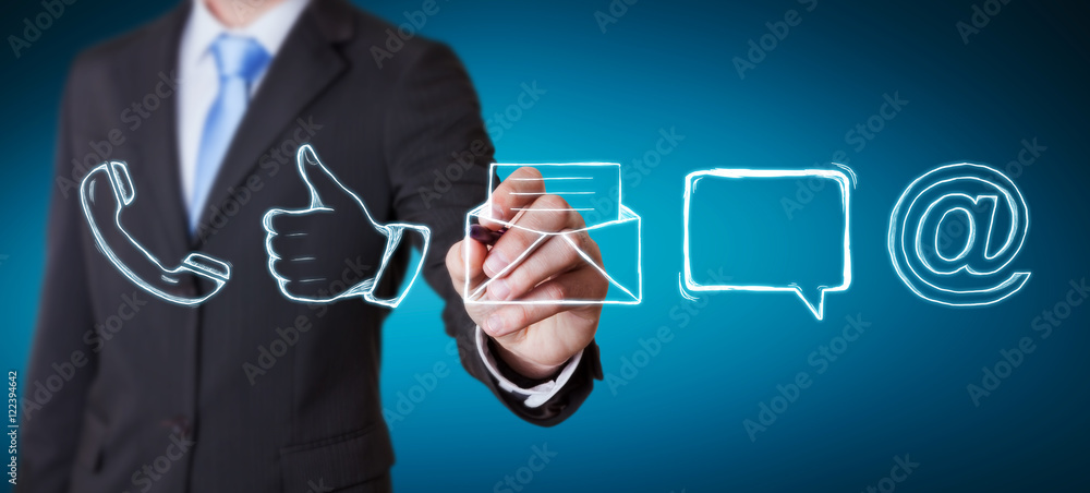 Businessman drawing manuscript contact icon with a pen