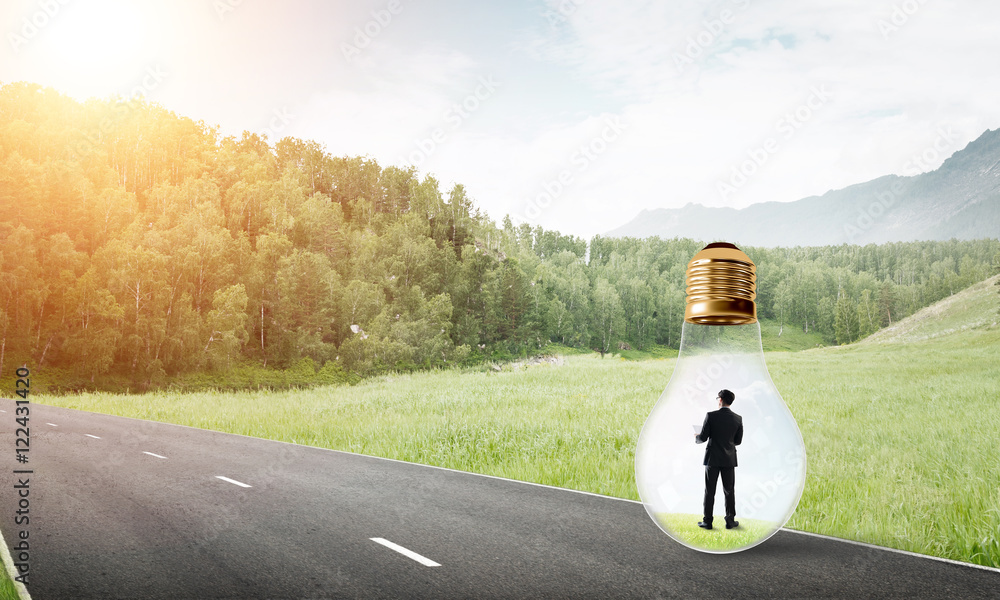 Businessman inside light bulb