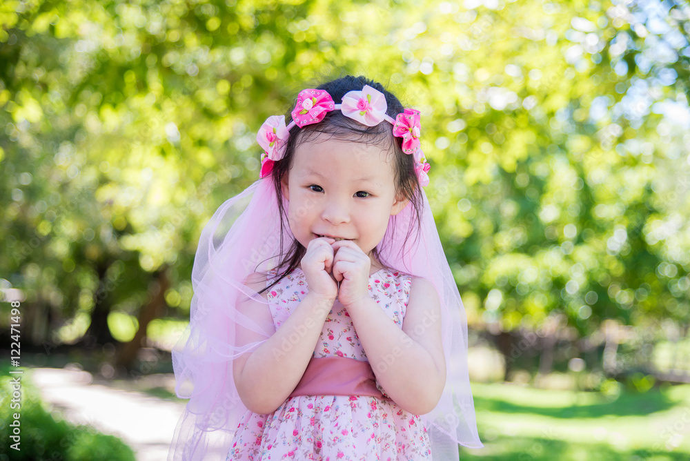 Little asian cute girl smiling in park