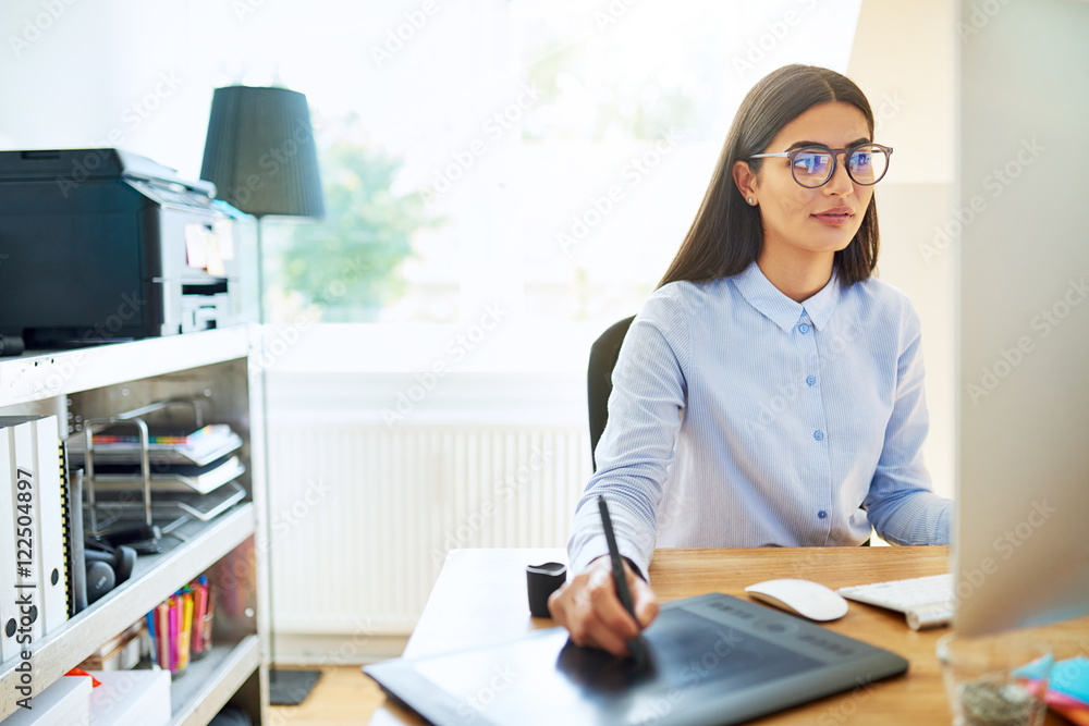 Young businesswoman working in a design studio