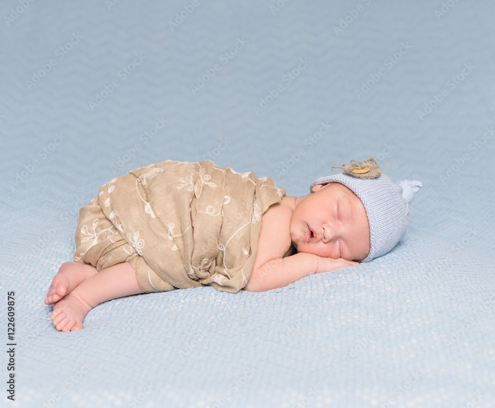 sleeping newborn baby with lovely cheeks