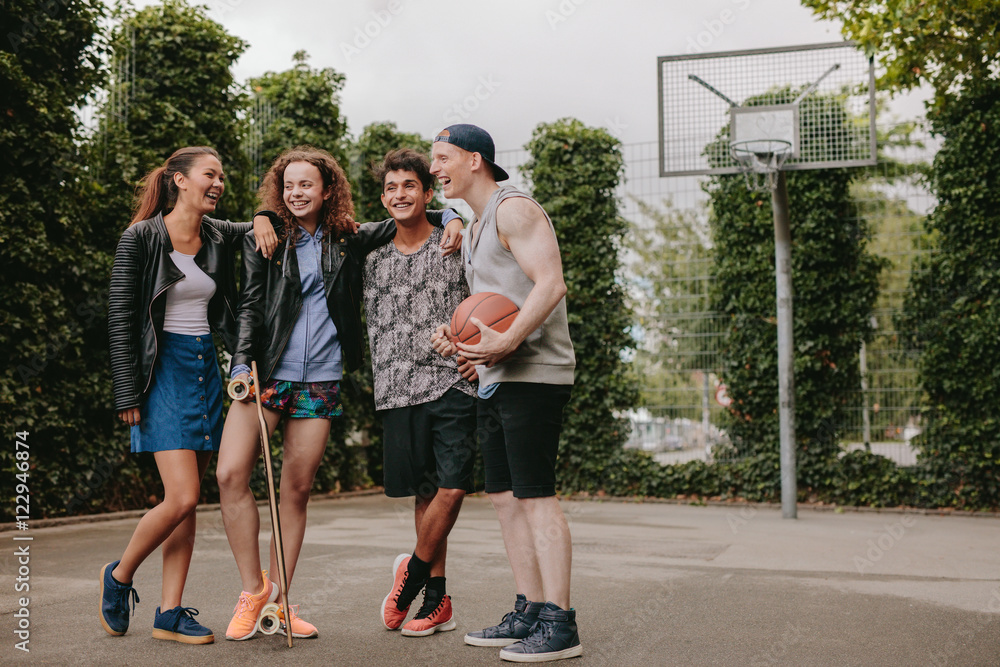 Multiracial group of people on basketball court