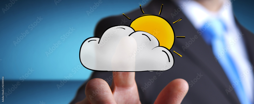 Businessman touching hand drawn cloud and sun icons