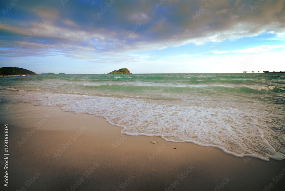 tropical island with storm clouds