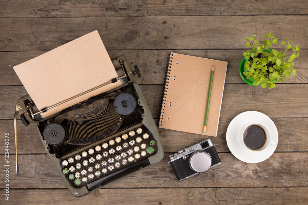 Vintage typewriter on the old wooden desk