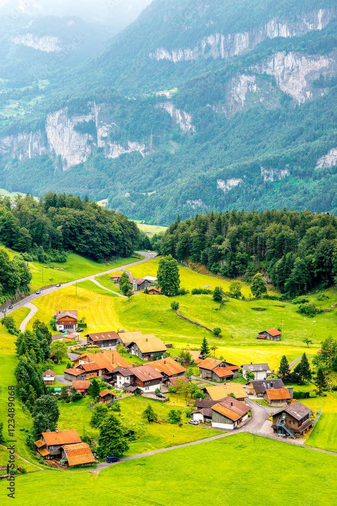 Beautiful rural landscape view on the green mountains and village near Interlaken city in Switzerlan