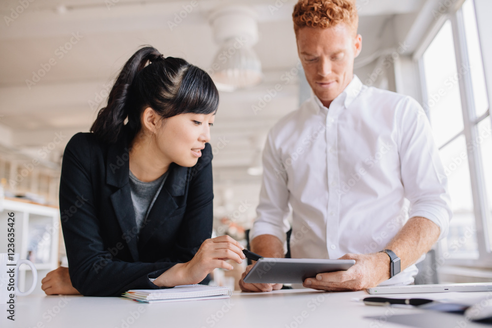 Business people working together on digital tablet