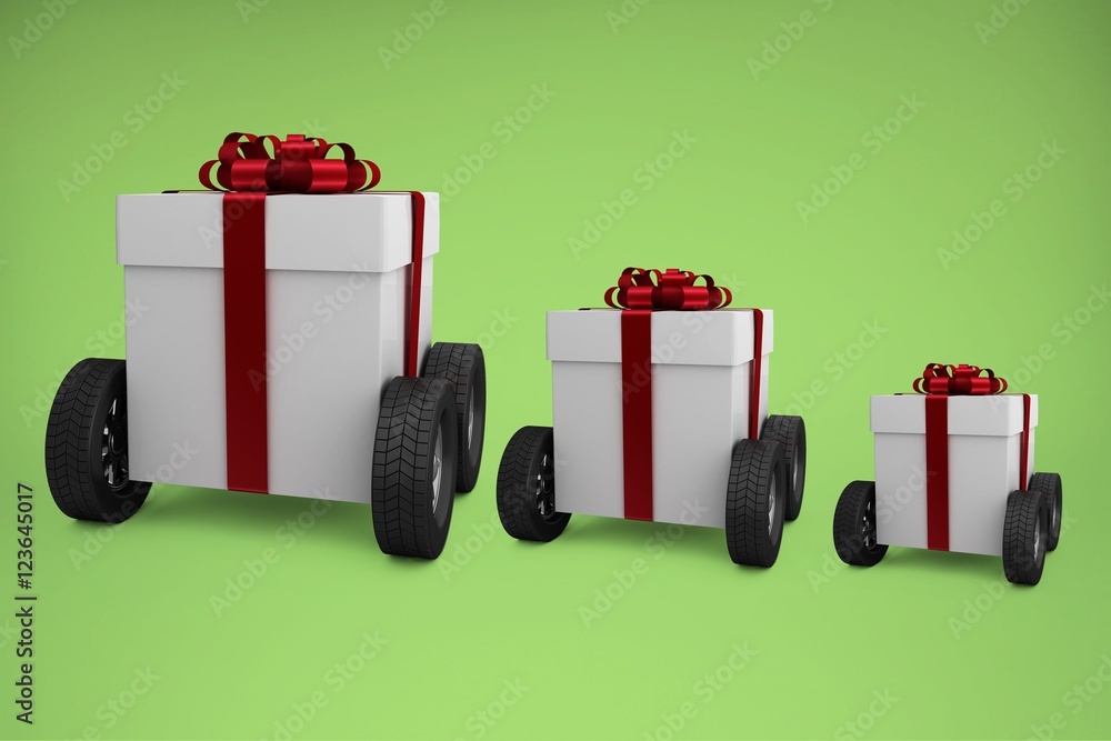 Composite image of gray gift box with wheels