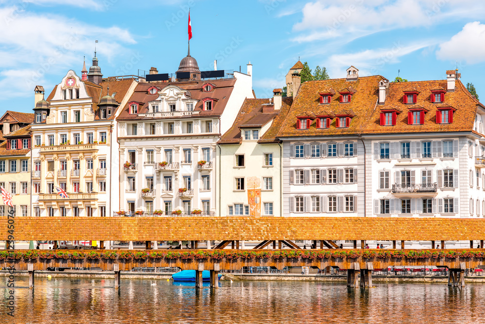 View on the riverside with old wooden bridge in Lucerne old town in Switzerland