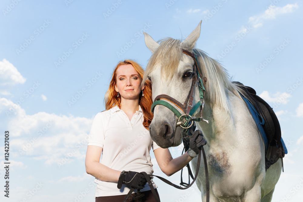 Beautiful picture of young woman with white horse