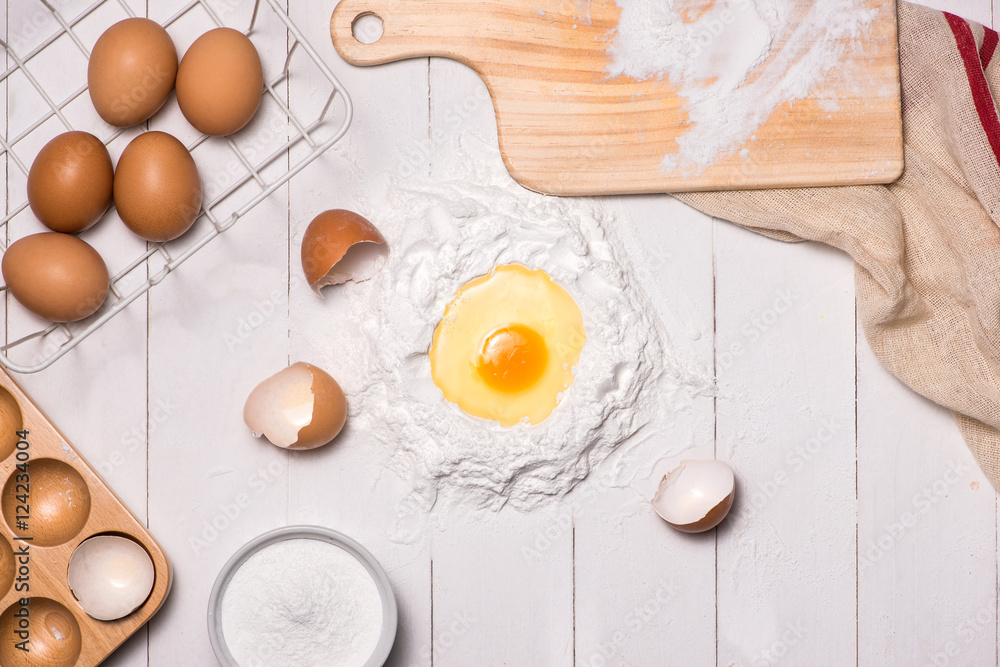 Egg in flour. Making dough background. Baking with raw eggs, sug