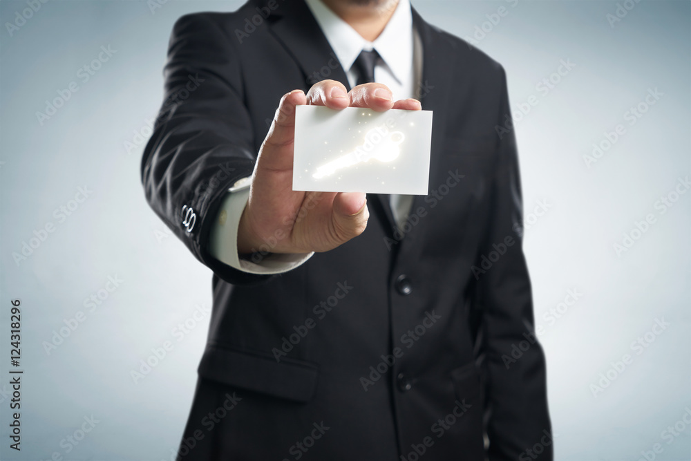 businessman in suit holding name card with dollar symbol