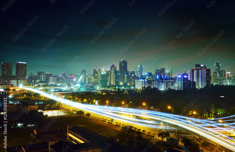 Abstract and car lighttrail  background, city skyline downtown background and highway interchanged n