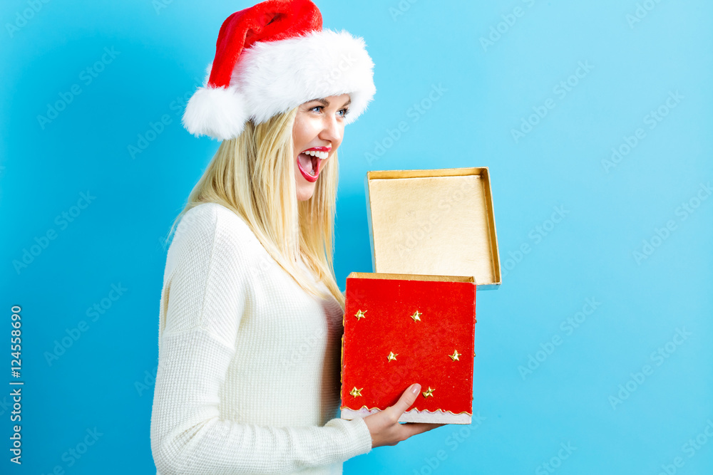 Happy young woman with Christmas present box