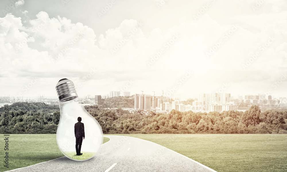 Businessman inside light bulb