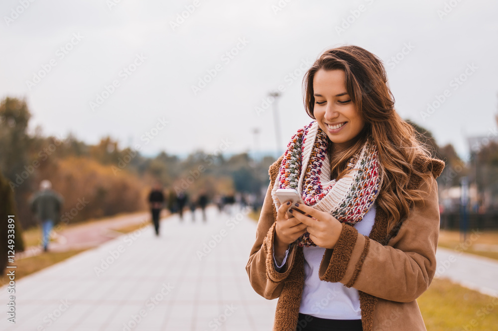 Checking messages in the park, outside