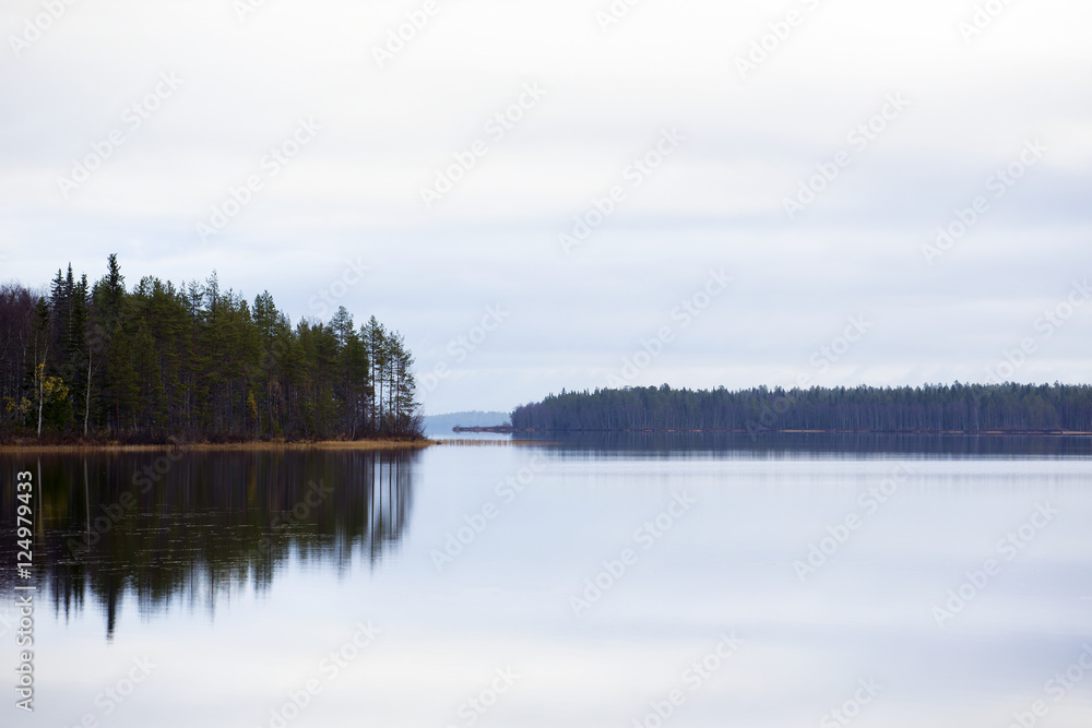 Autumn day. Reflections in the water.