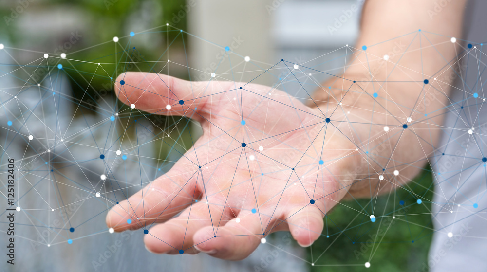 Businessman holding digital data network in his hand