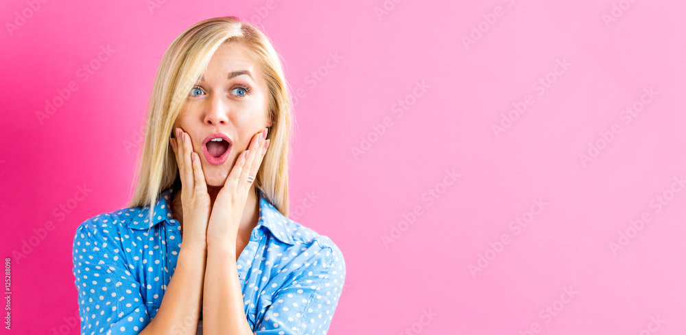 Surprised young woman posing