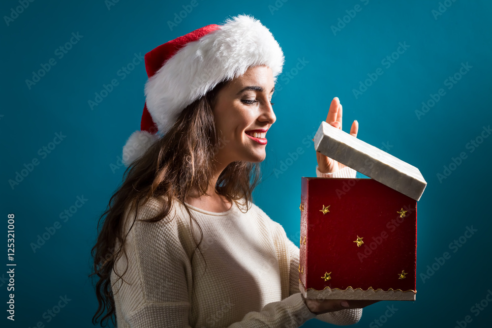 Happy young woman with Christmas present box