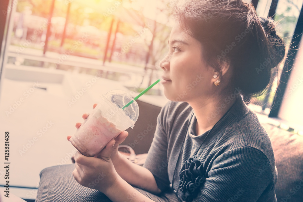 Woman drinking coffee at home