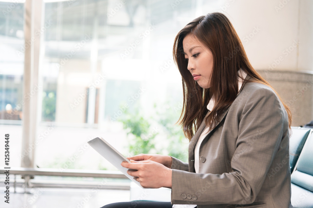 beautiful asian young girl with tablet