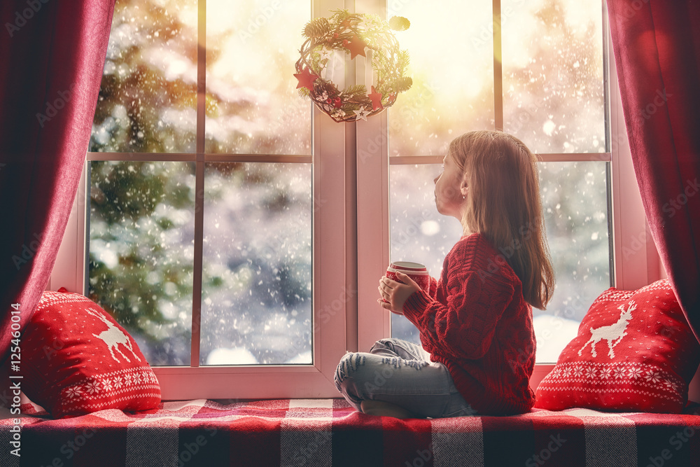 girl sitting by the window