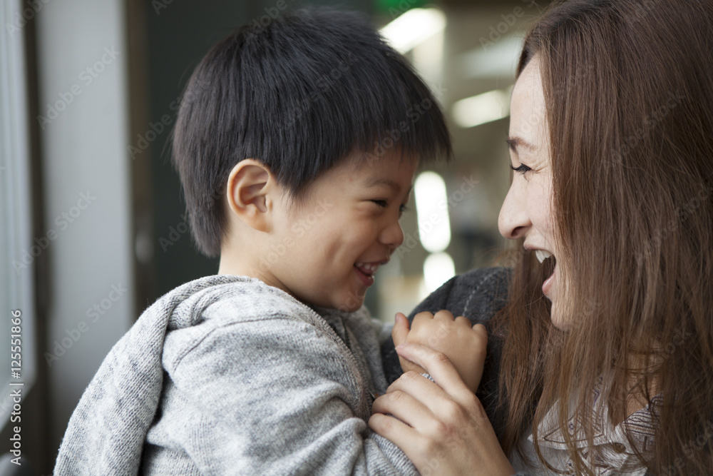 Mother and son laughing together