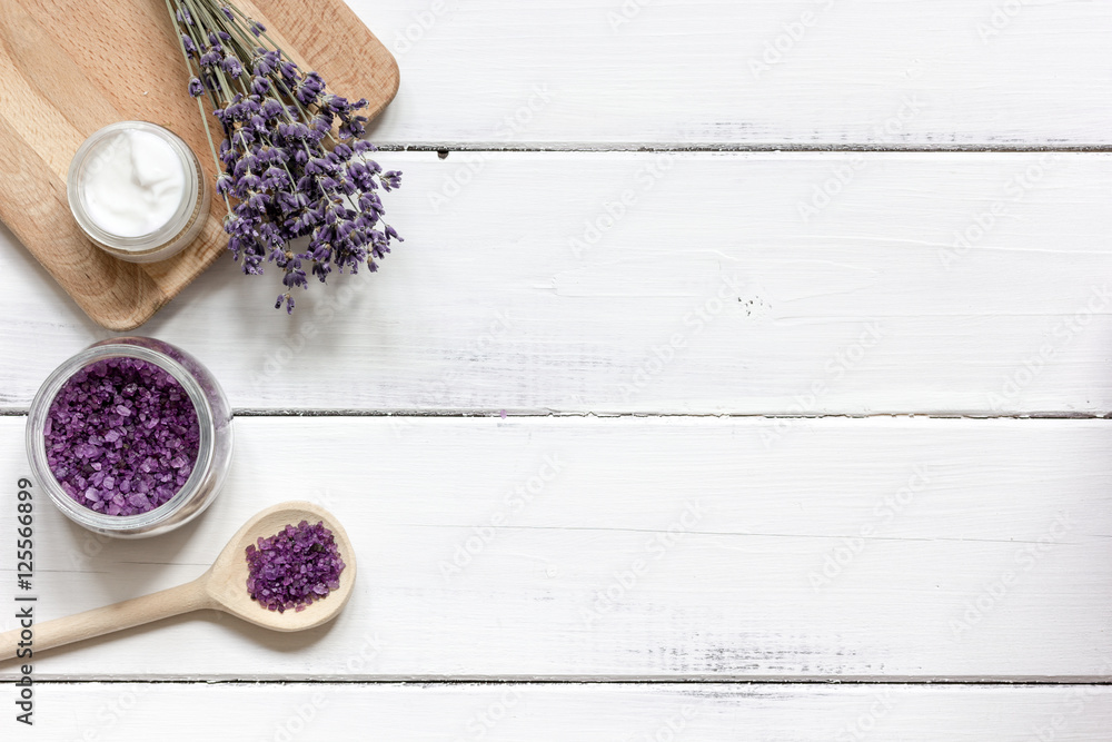 natural creams with lavender flowers on wooden table