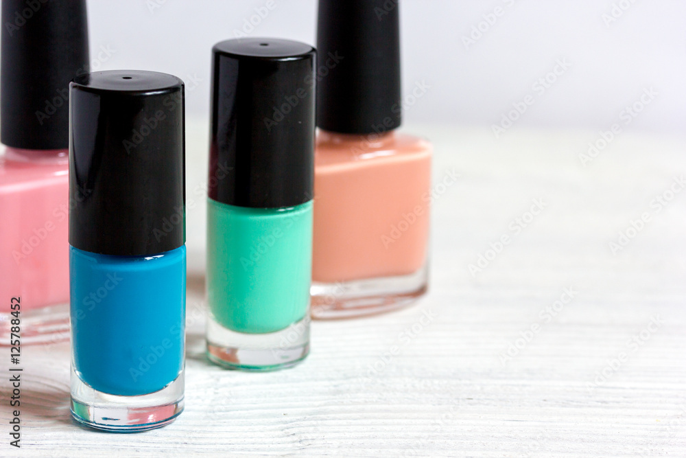 group of nail polish on wooden background