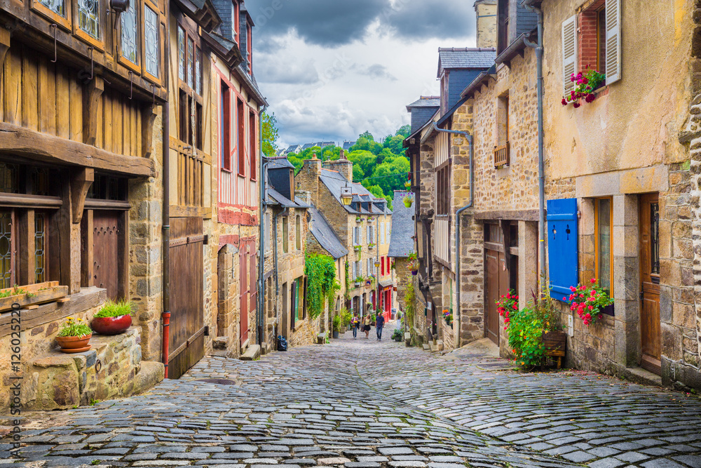 Idyllic street scene with traditional houses in old town in Europe