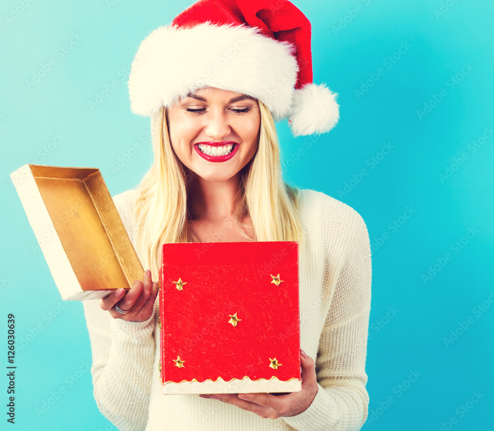 Happy young woman with Christmas present box