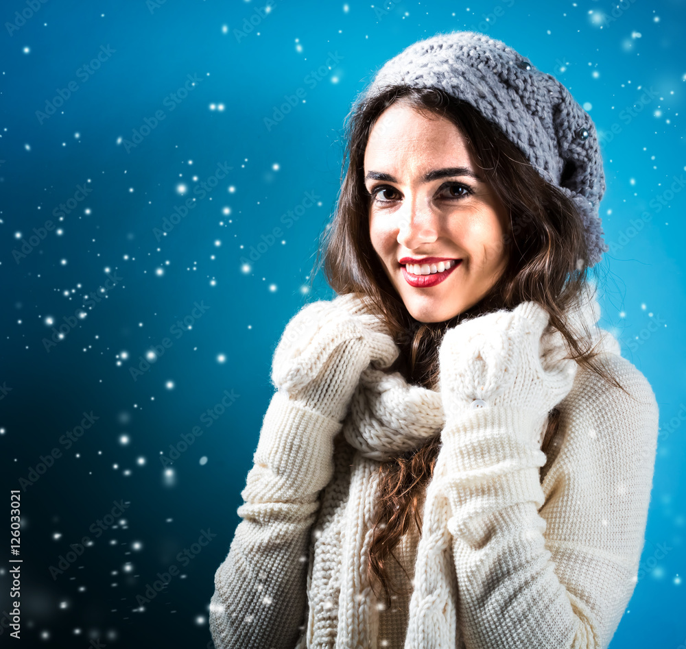 Happy young woman in winter clothes