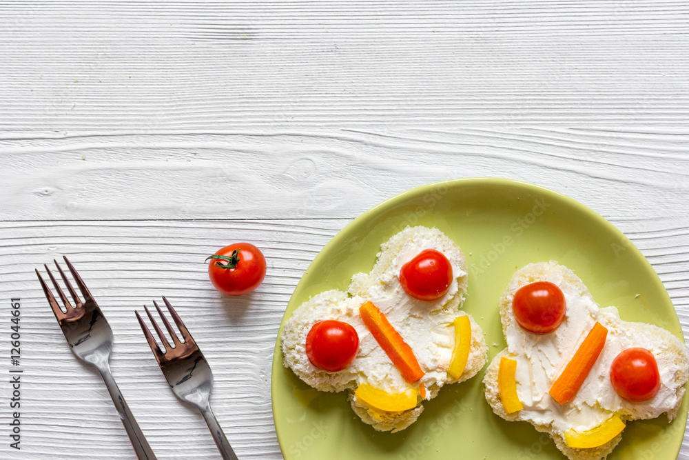 kid breakfast butterfly sandwiches top view on wooden background