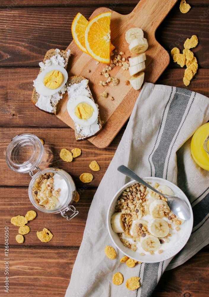 healthy breakfast bowl of yogurt with granola and eggs