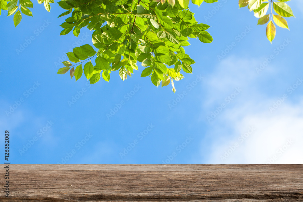 Selected focus empty brown wooden table and over blue sky and br