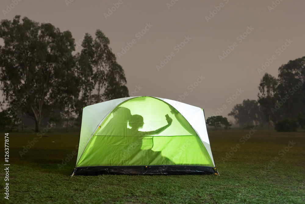 silhouette of couple camping