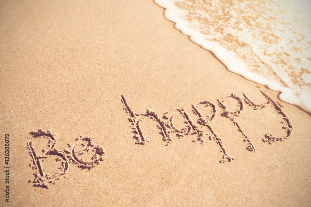 Be happy written on sand