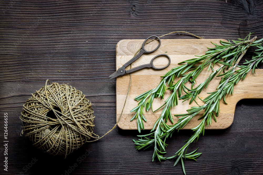 rosemary bunch on wooden table top view