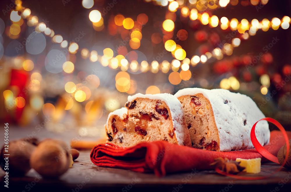 Christmas stollen. Traditional sweet fruit loaf with icing sugar