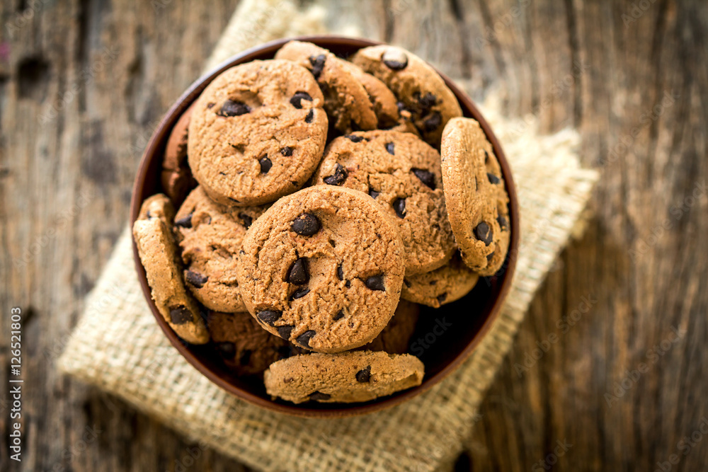 Top view and overhead shot of  chocolate chip cookies in cup bow