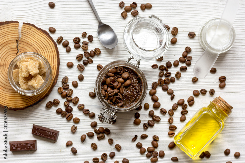 Body scrub of ground coffee top view on wooden table