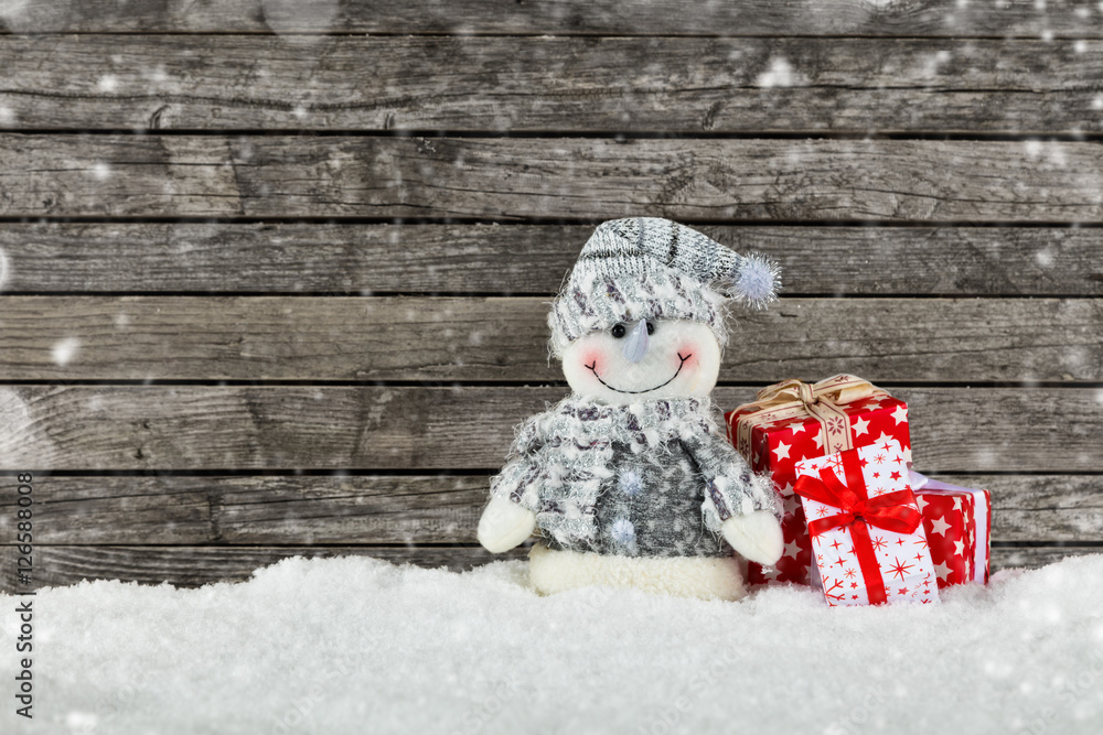 Christmas background with snowman and gifts