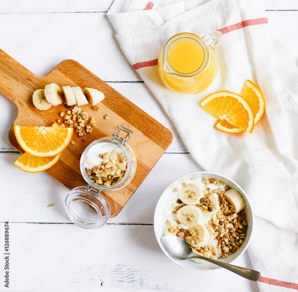 breakfast on wooden table with granola top view