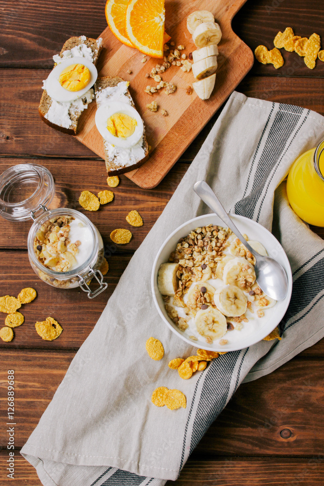 healthy breakfast bowl of yogurt with granola and eggs