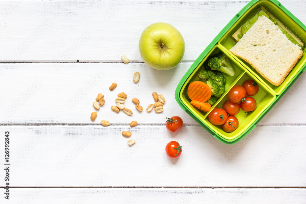 preparing lunch for child school top view on wooden background