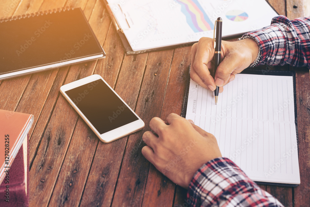 Businessman or freelance working on a desk