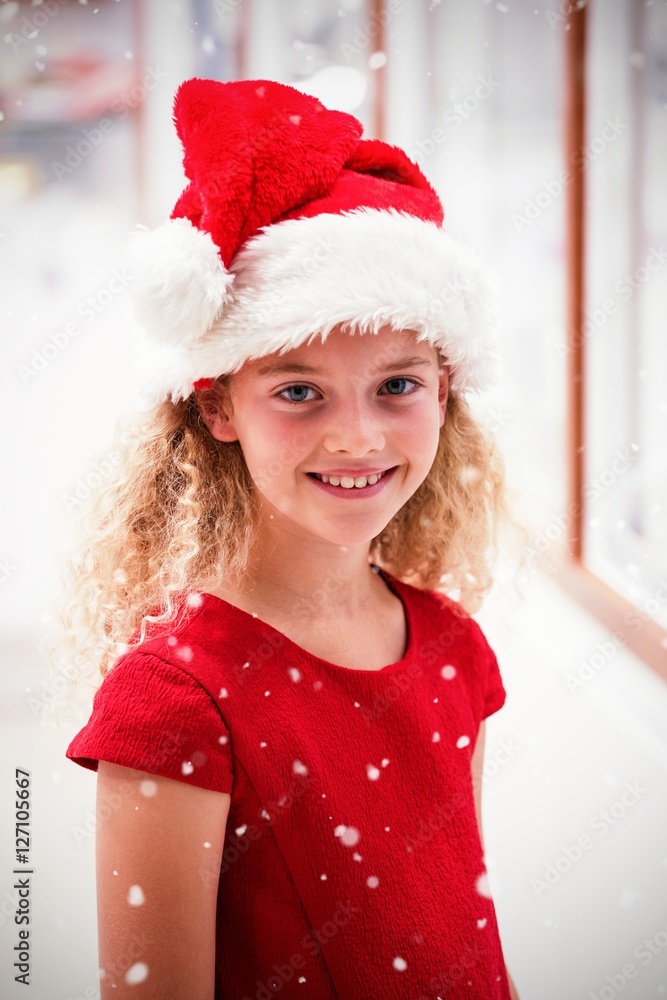 Composite image of portrait of girl in christmas attire