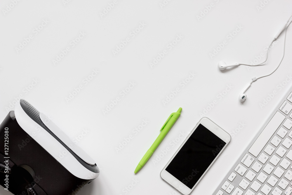 virtual reality glasses with smartphone, keyboard on white background